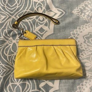 Patent leather yellow coach wristlet